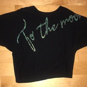 Black sweater like shirt that’s says “to the moon”